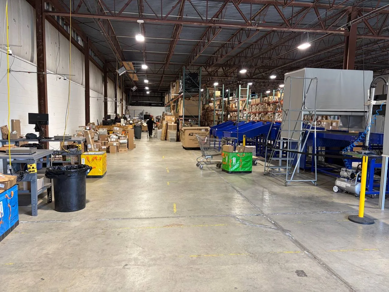 Order fulfillment workstations and equipment inside the Omnaris warehouse
