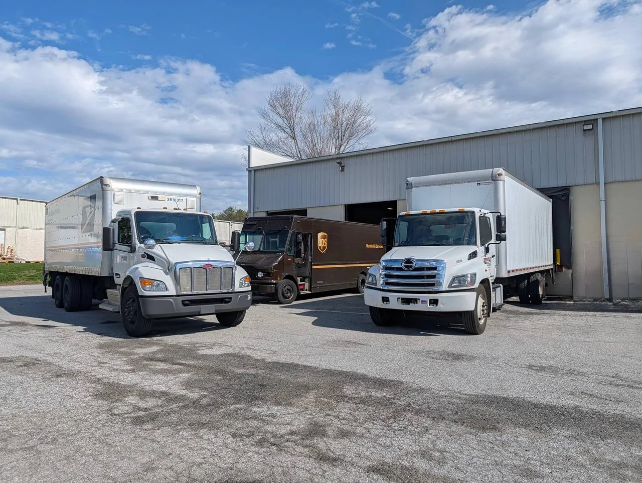 Delivery vehicles positioned at the Omnaris warehouse loading area